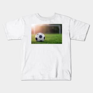 Soccer ball with sunset Kids T-Shirt